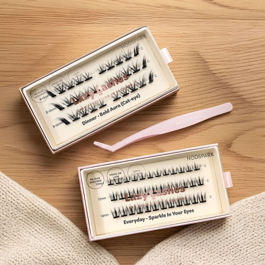 Lazy Lashes City Chic Starter Kit with Everyday Sparkle In Your Eyes and Dinner Bold Aura press-on lash sets next to a pink precision tweezers.