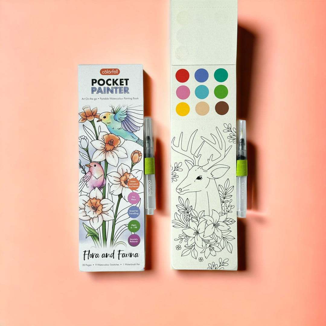 Flora & Fauna pocket painter watercolor painting booklet shown with paint palette pages and a brush on a coral pink background.