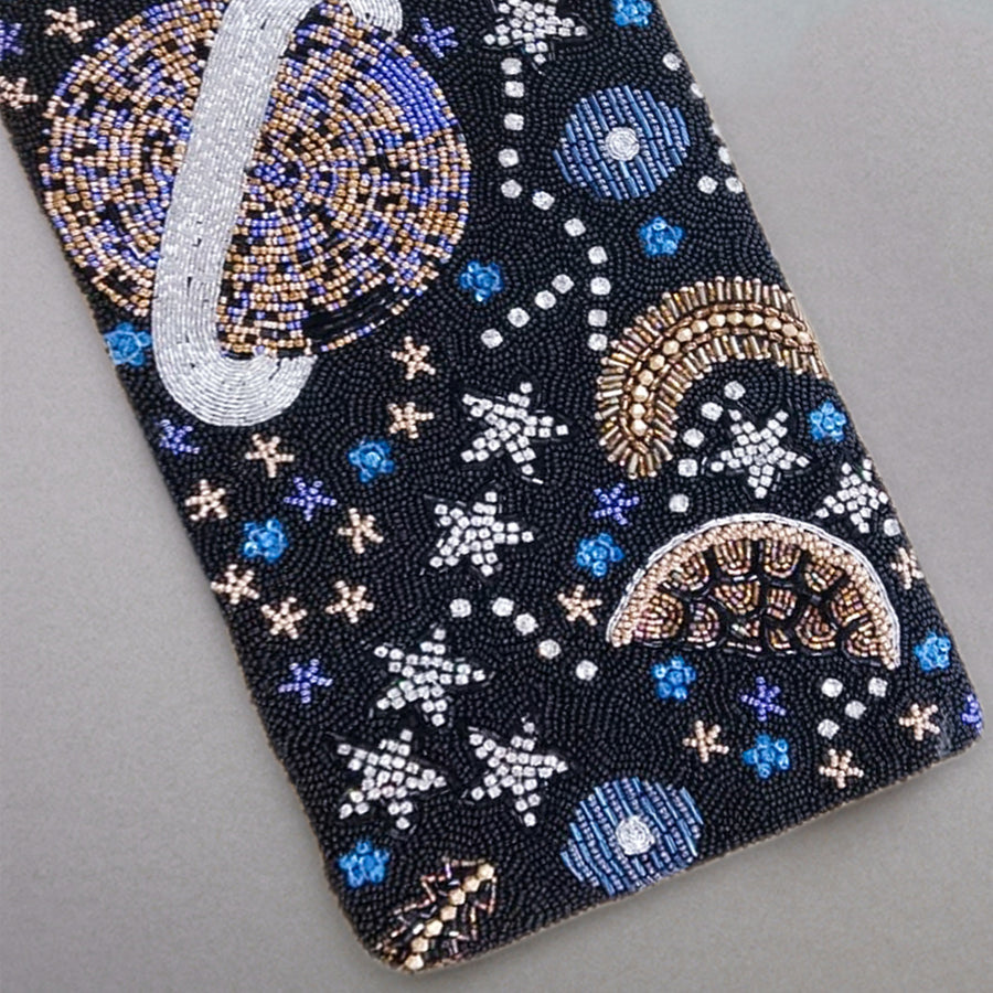 Black rectangular clutch intricately hand-beaded with a celestial space motif featuring planets, stars, and crescent moons in blue, silver, and gold beads.